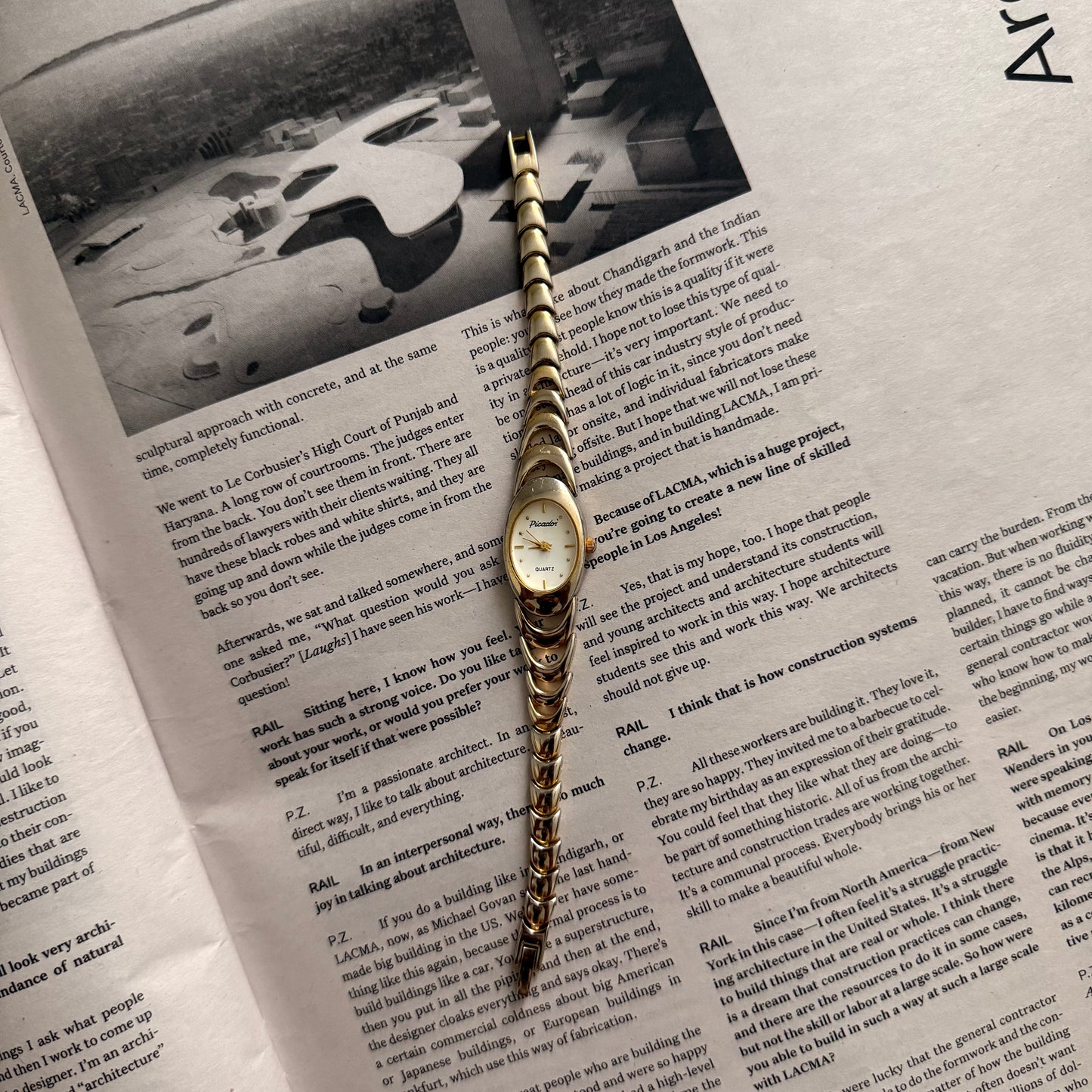 Two tone crescent oval watch