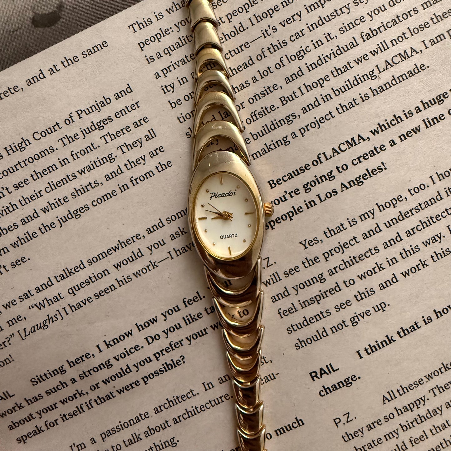 Two tone crescent oval watch