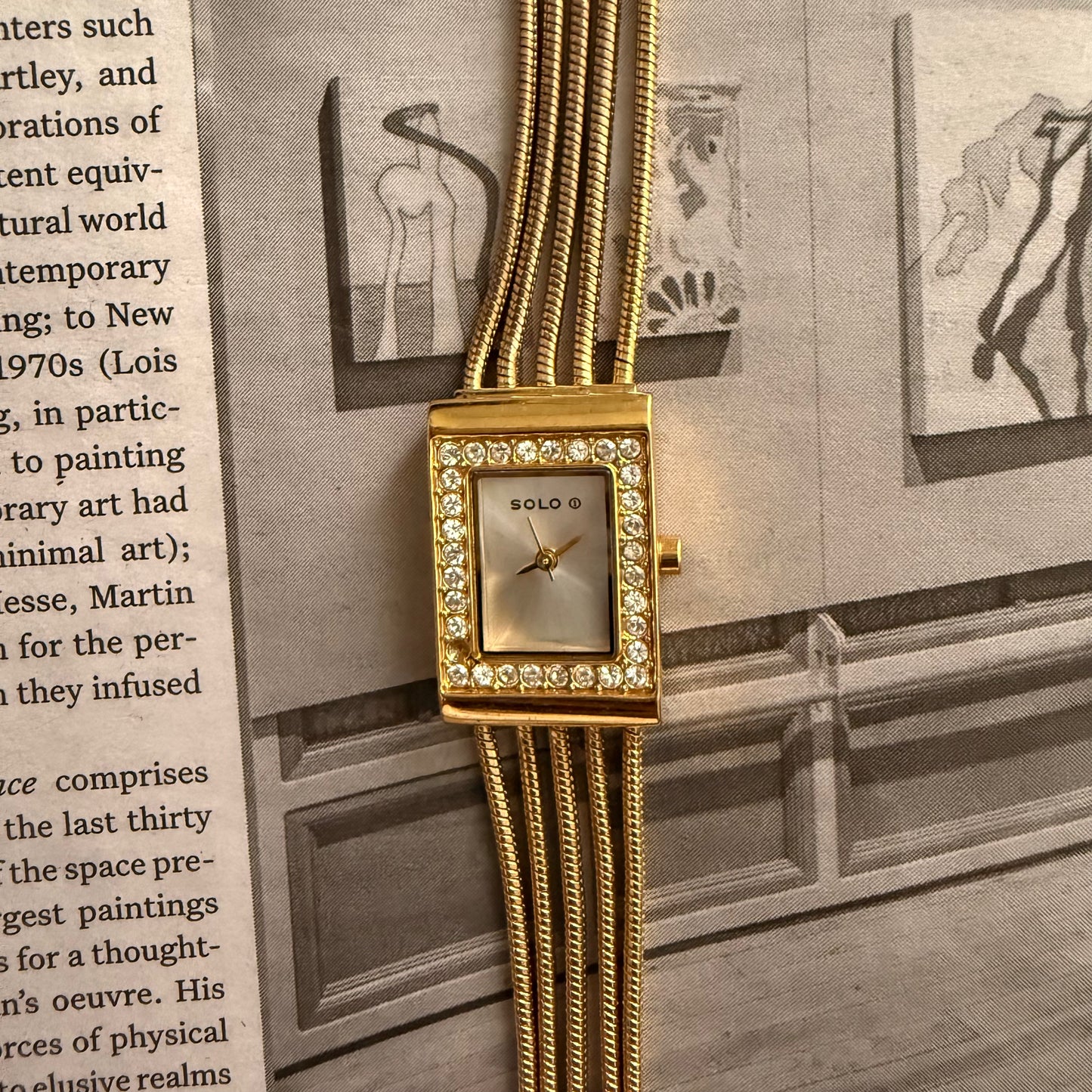 Gold bracelet embellished rectangle face watch