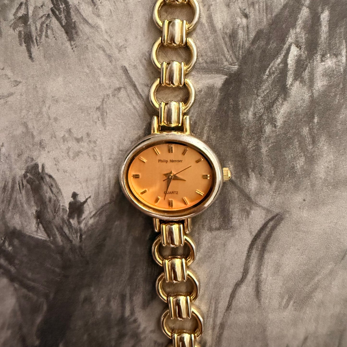 Peach face oval link silver watch