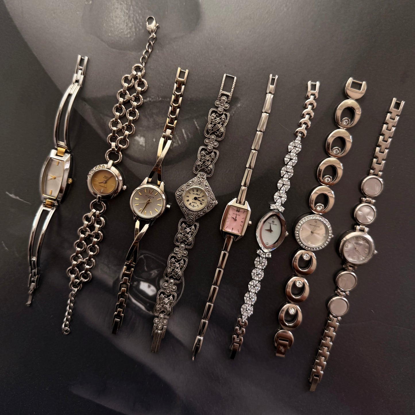 Silver circle gold face bracelet watch