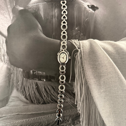 Silver oval face gemmed link band watch