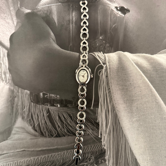 Silver oval face gemmed link band watch