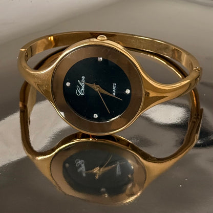 Gold circle black face bangle watch