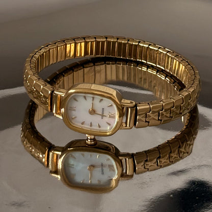 Gold square face stretch bangle watch
