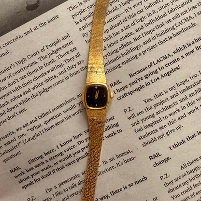 Gold black face hearts detail band watch