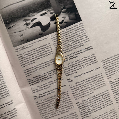 Two tone crescent oval watch