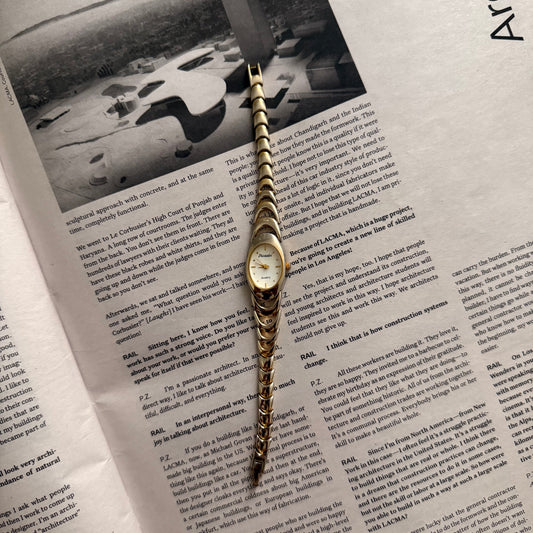 Two tone crescent oval watch