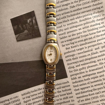 Two tone matte full oval puffer watch