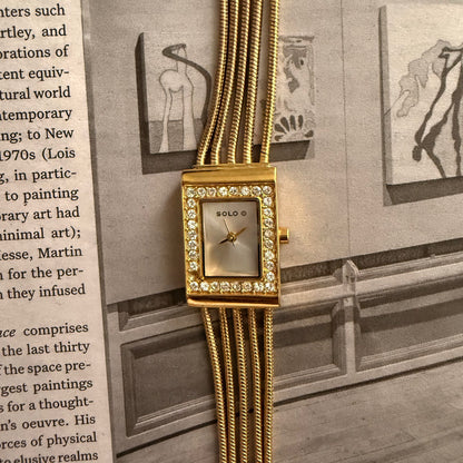 Gold bracelet embellished rectangle face watch