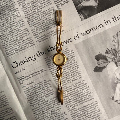 Croissant style twist cuff watch