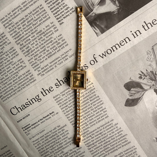 Gold square face tennis bracelet watch