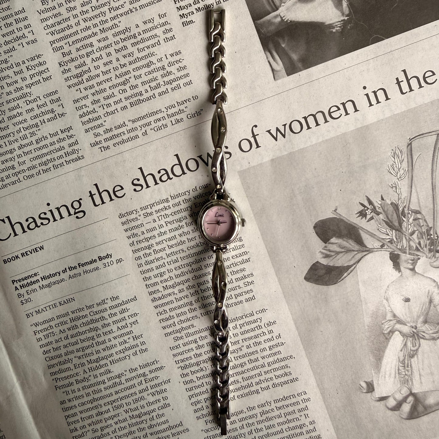 Silver oval pink face twist gemmed band watch
