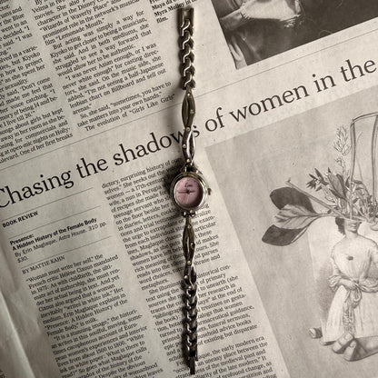 Silver oval pink face twist gemmed band watch