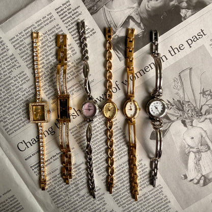 Gold rectangle black face tennis cuff watch