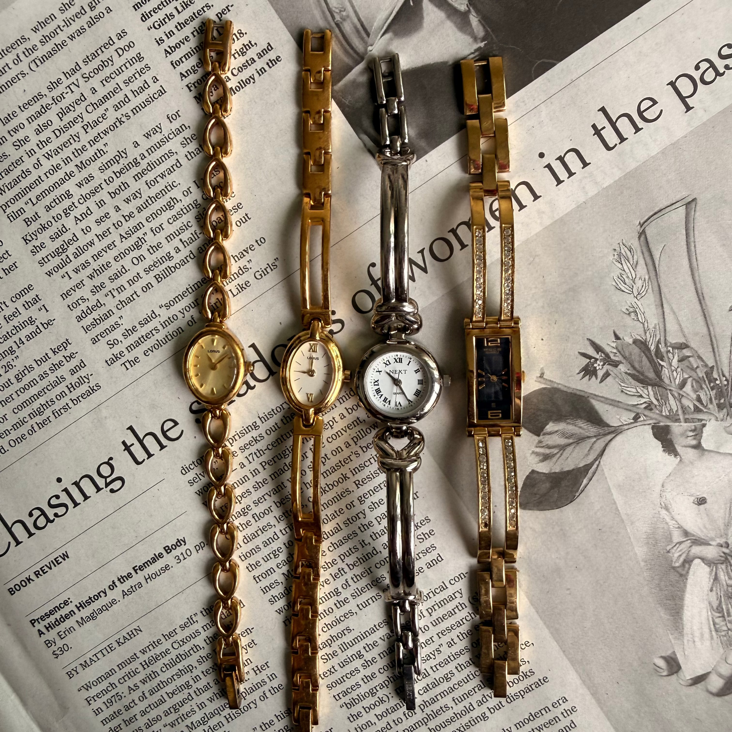 Gold rectangle black face tennis cuff watch